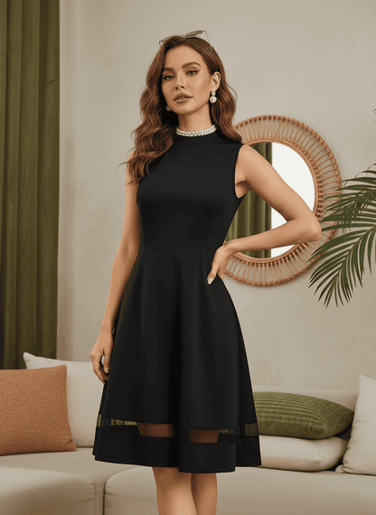 Elegant Black Sleeveless Dress with Sheer Hem | Versatile Western Wear - Uvercee